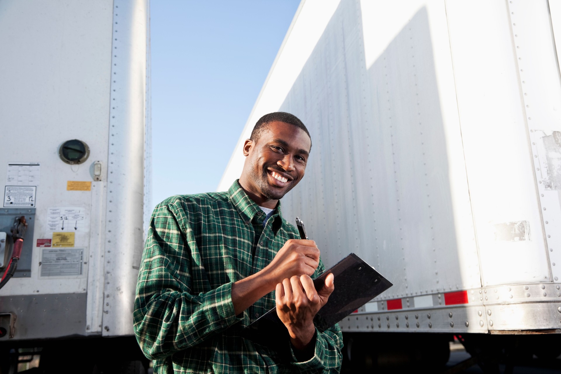 African American truck driver with clipboard